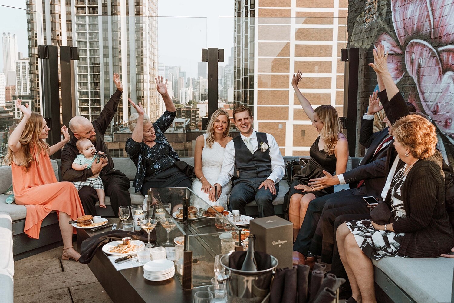 Bride and groom celebrating intimate Chicago elopement with family