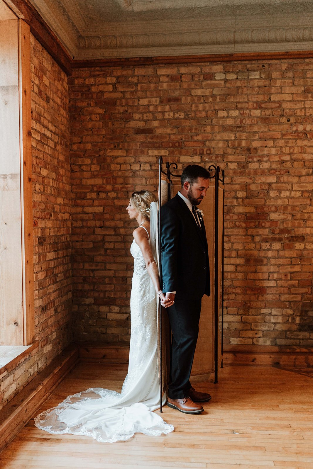 Bride and groom have a moment before their wedding at Highland Lofts