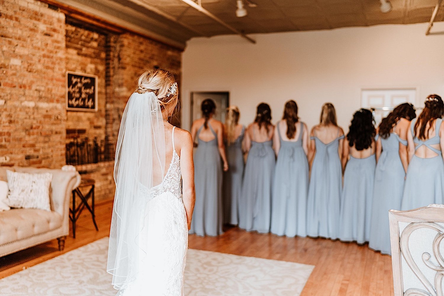 Bride has a first look with her bridesmaids at her Highland Loft Wedding