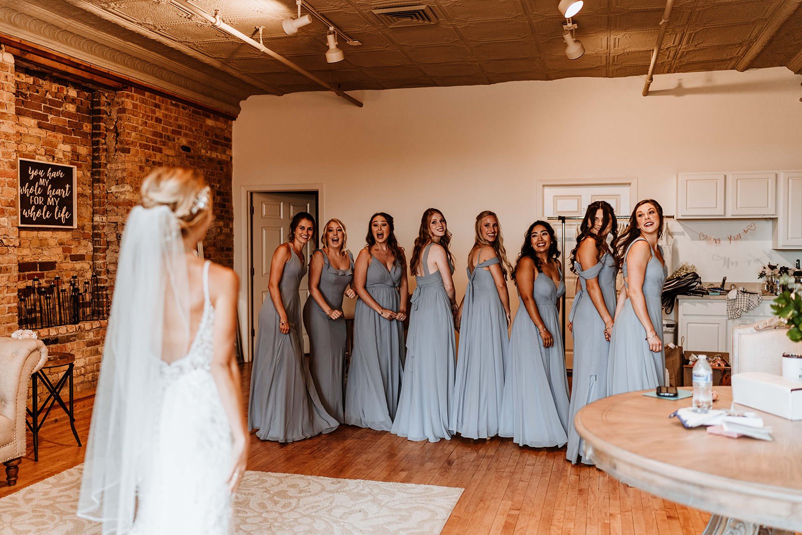 Bride has a first look with her bridesmaids the morning of her wedding day
