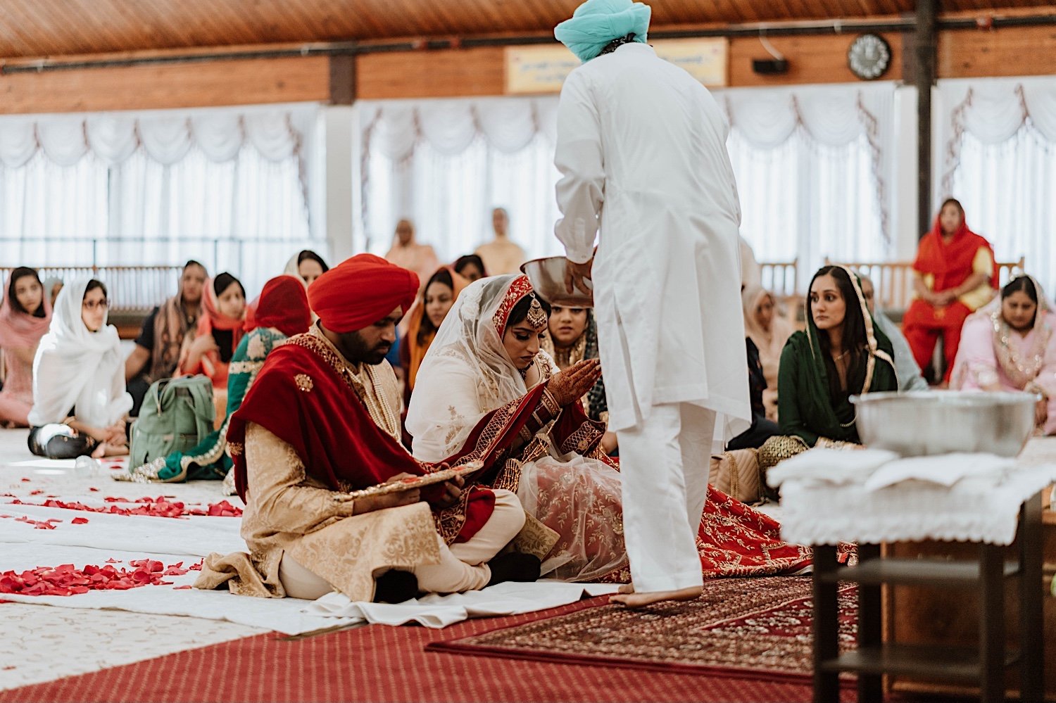 Bride and groom receive blessing during Indian Wedding Ceremony