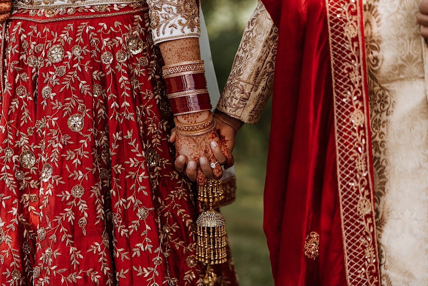 Bride and groom hold hands after Indian wedding ceremony