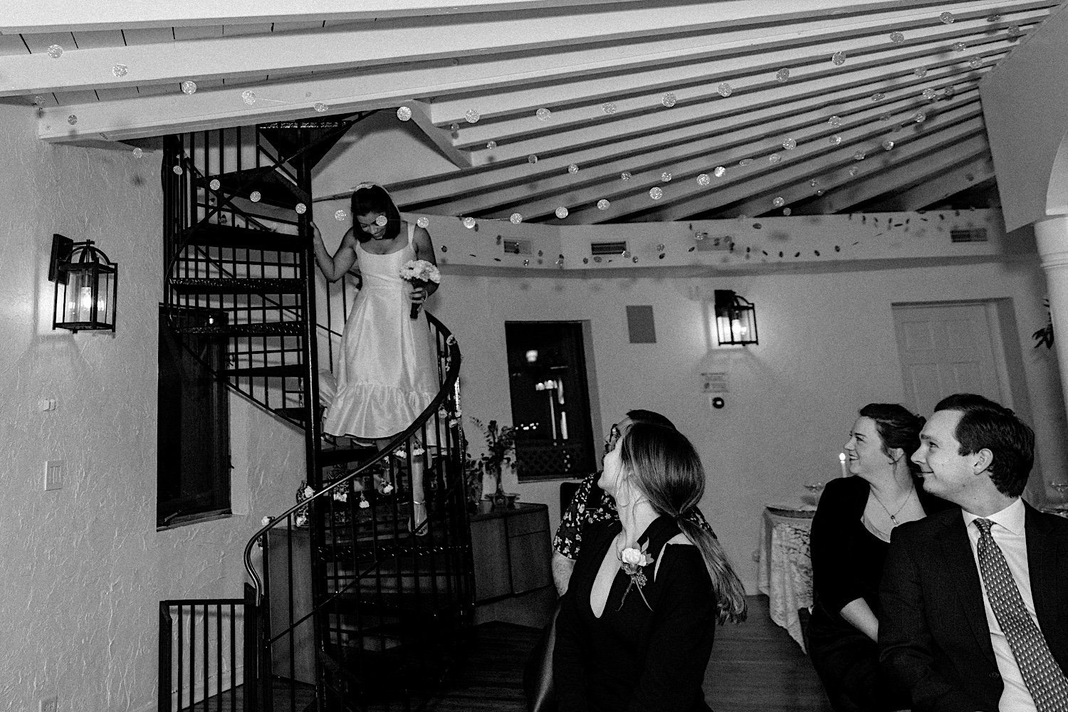 Bride enters intimate Indiana wedding ceremony via spiral staircase