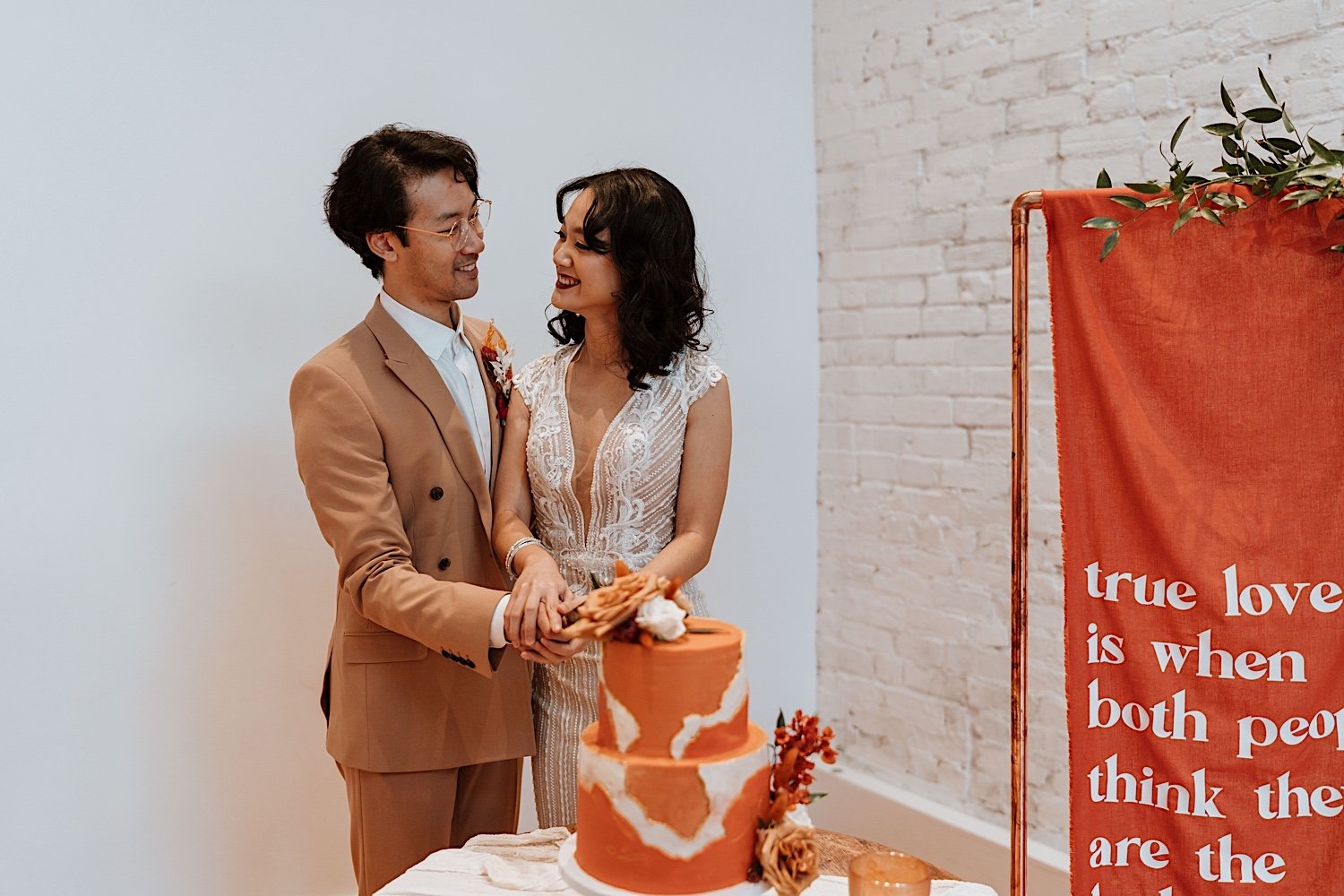 Couple cuts cake for their Cincinnati elopement