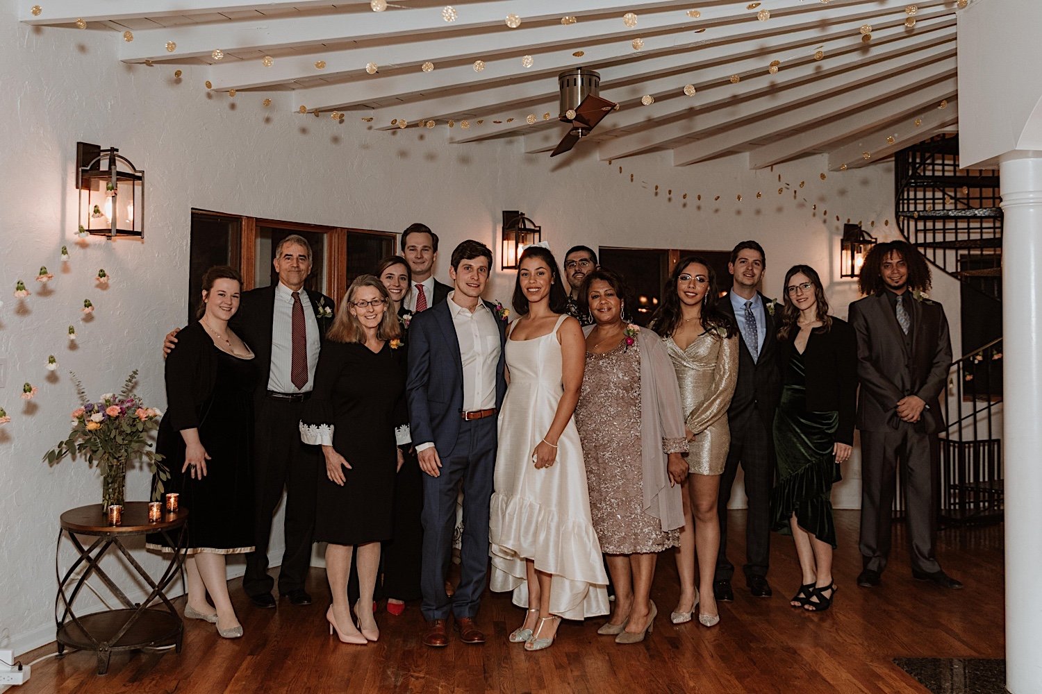 Newly weds pose with guests of their intimate Indiana wedding
