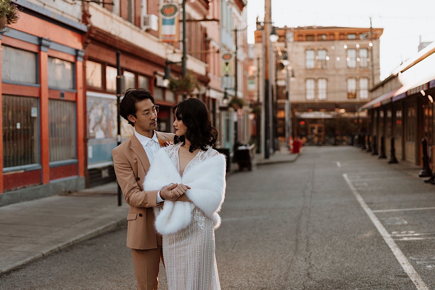 Couple poses in Findlay Market for Cincinnati elopement