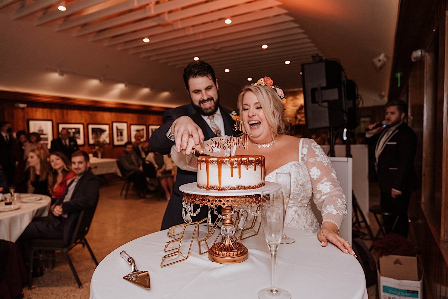 Bride and groom cut their cake together at Lake Ellyn Boathouse wedding
