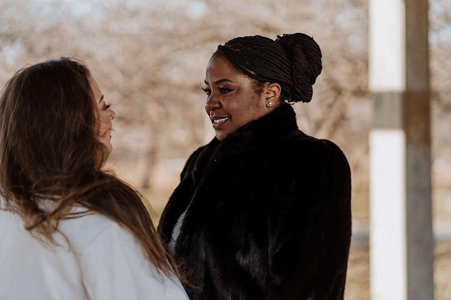 Brides smile with each other in Humboldt Park