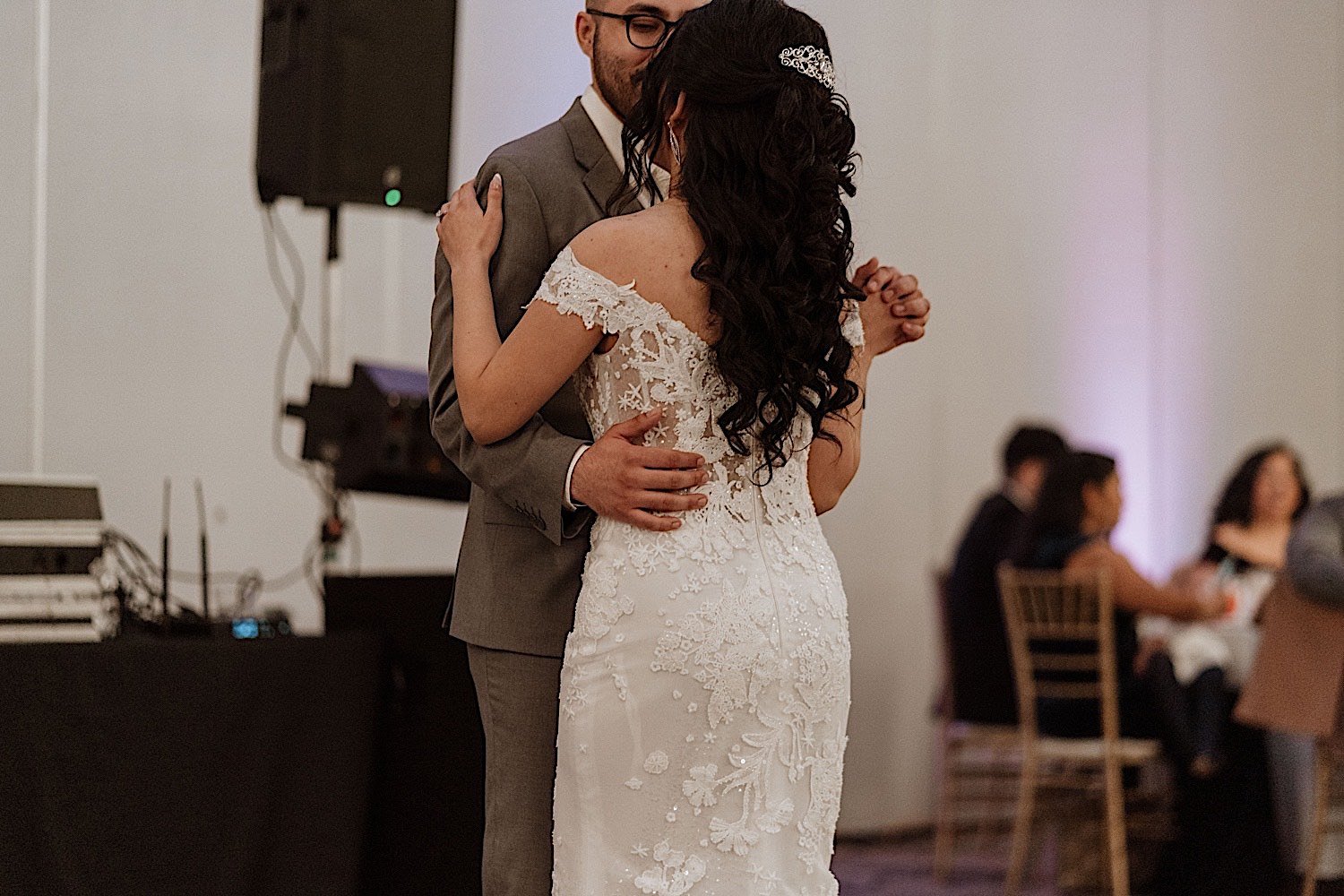 Bride and groom share first dance during their Chicagoland ballroom wedding reception