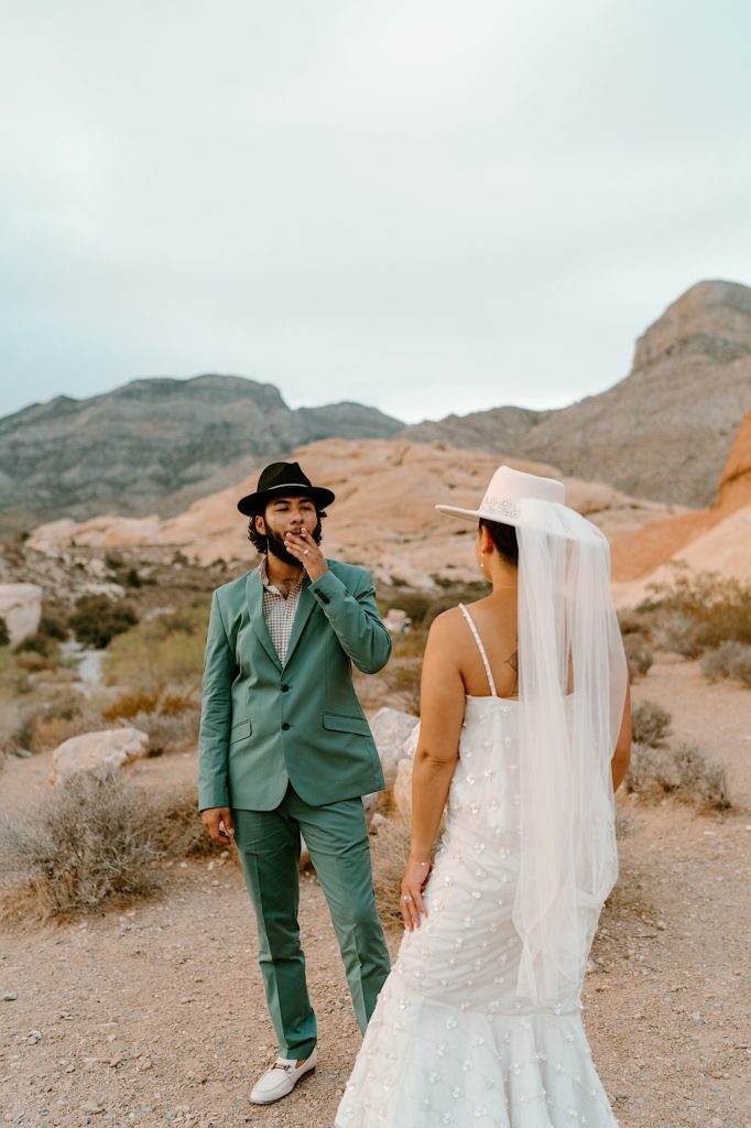 The bride and groom sharing a joint during their Las Vegas Elopement