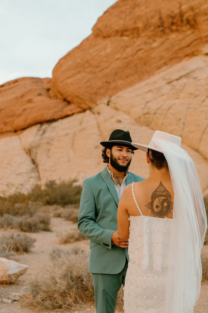 The bride and groom exchanged their vows privately surrounded by the red rocks in Las Vegas.