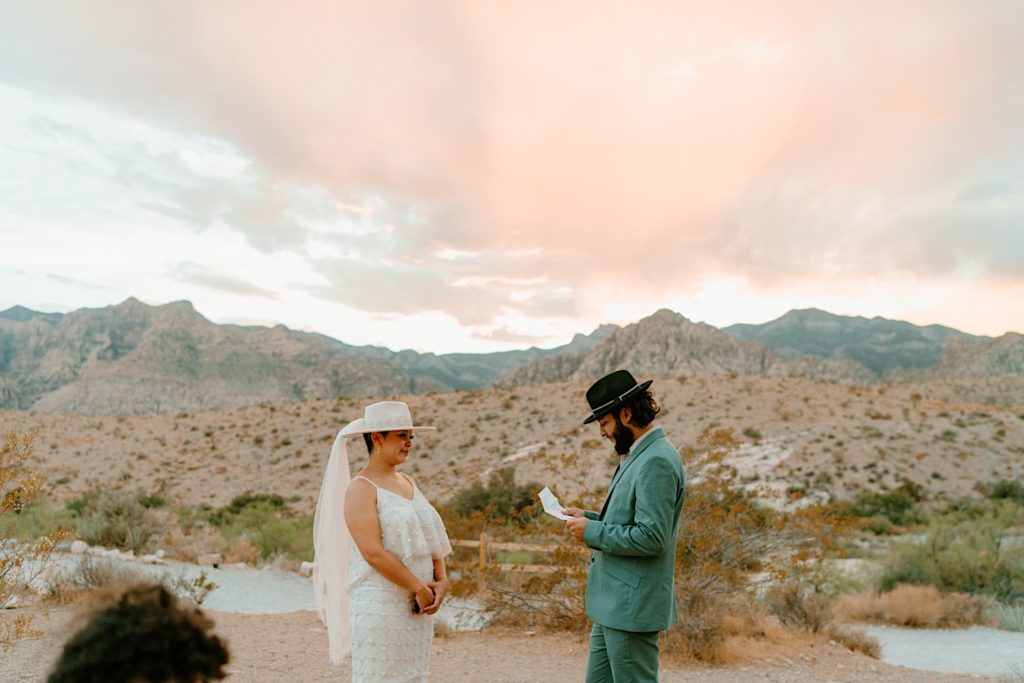 The bride and groom exchanged their vows privately surrounded by the red rocks in Las Vegas.