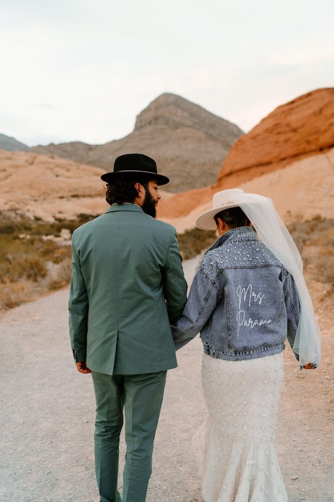 The bride and groom stand with their backs to the camera during their Nevada Elopement