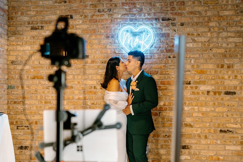 The Bride and groom use their photo booth at their Chicago wedding