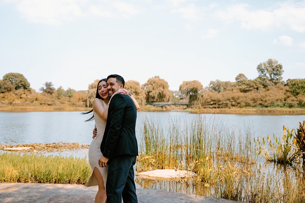 A bride and groom hold each other at the Chicago Botanic Gardens