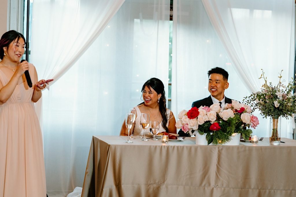 Guests share a toast for the bride and groom at their Joliet Union Station Wedding.