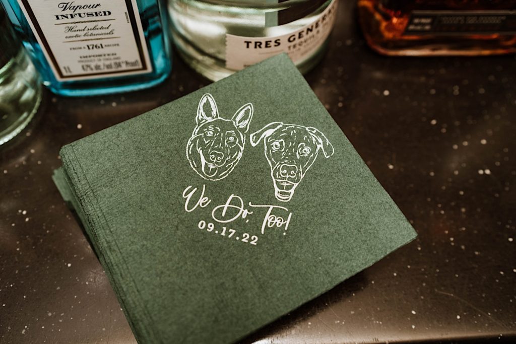 A custom napkin with the bride and grooms pets featured on them as graphics.