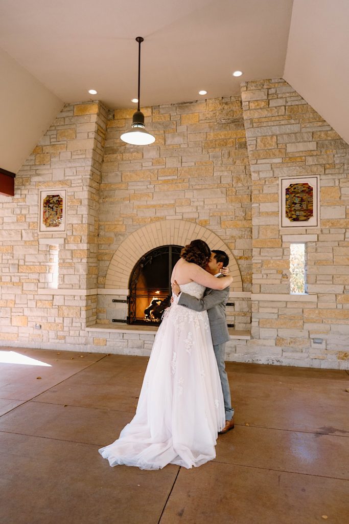 A bride and groom share their first dance under the pavilion at the Grove Redfield Estate