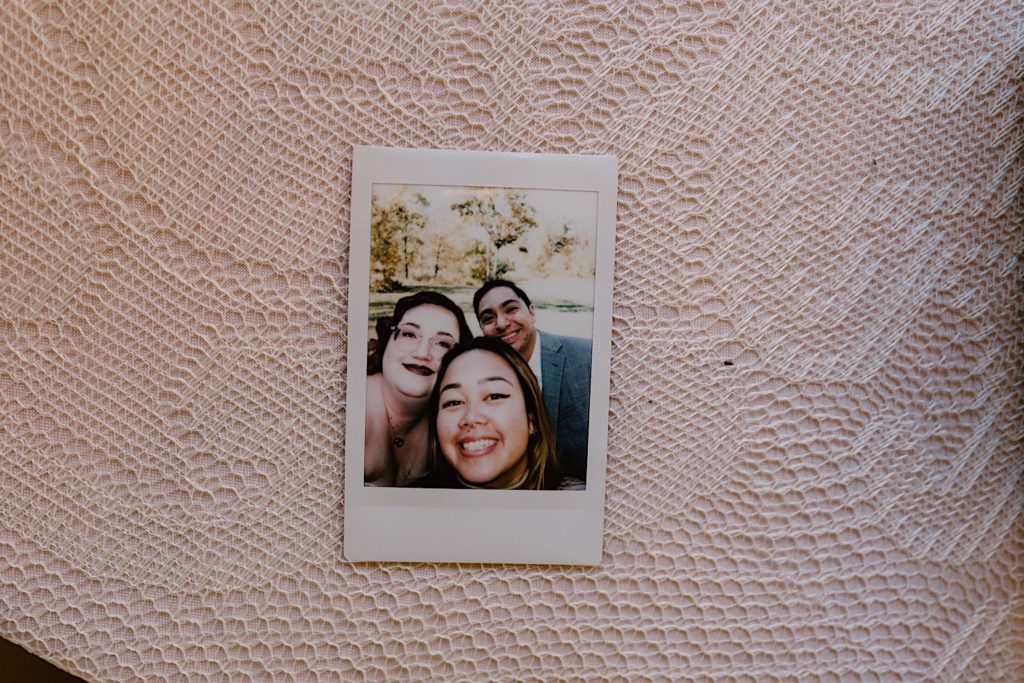 A polaroid selfie with the bride and groom and photographer Kriztelle Halili