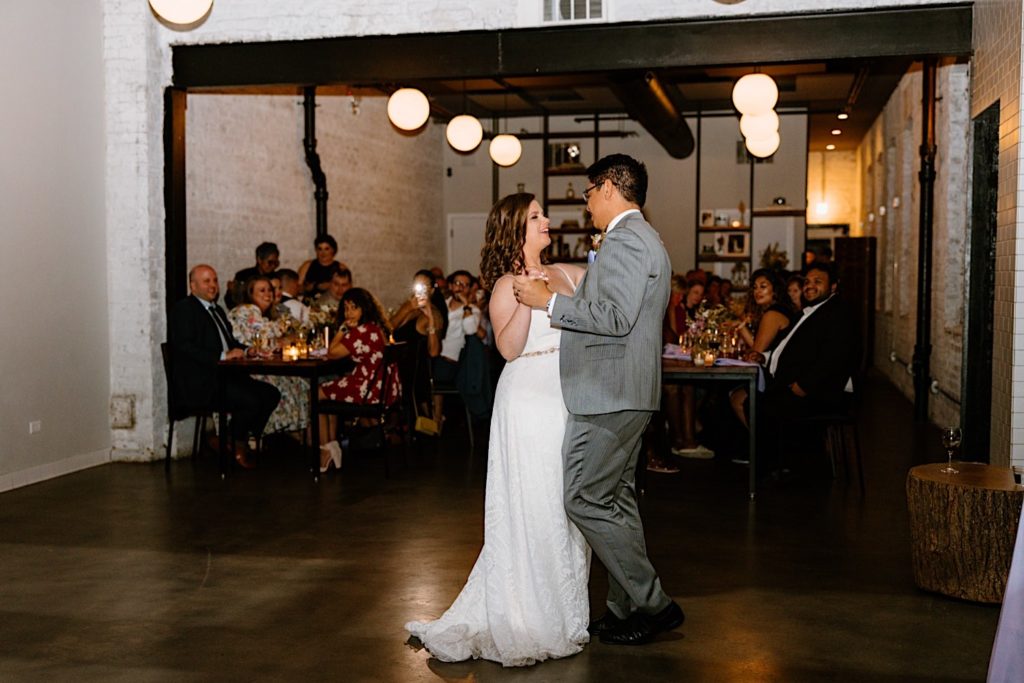 A bride and groom dance together at their wedding at the Lytle House Chicago.