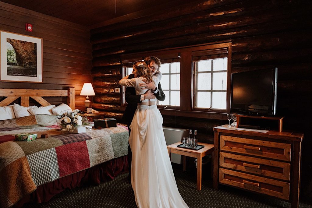 A bride hugs his groom during their first look at Starved Rock State Park.