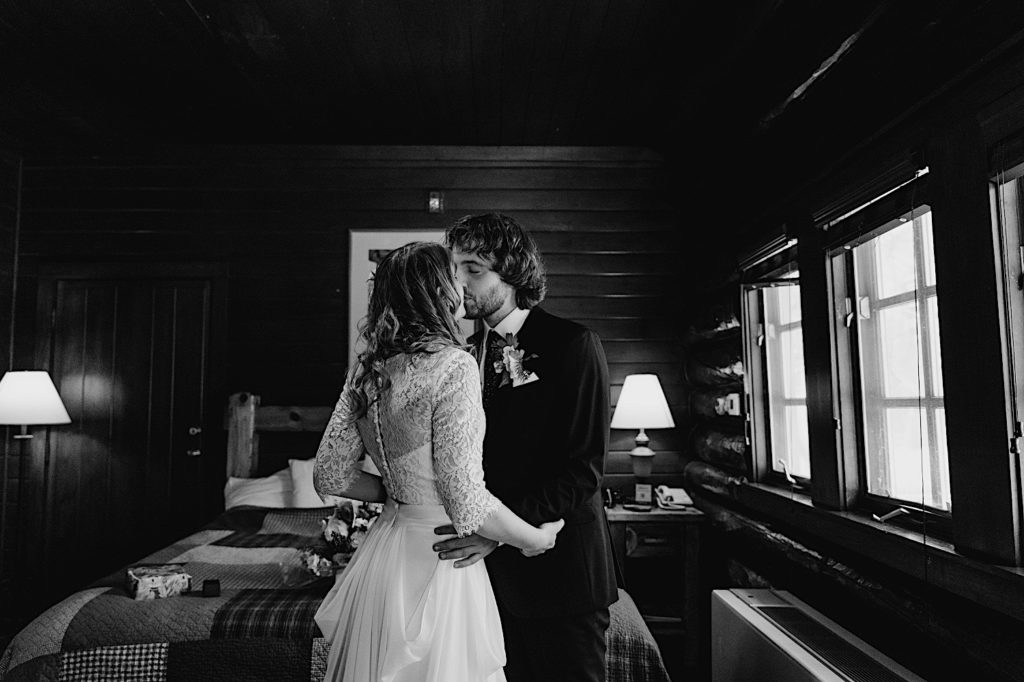 A bride and groom kiss in their cabin during their elopement at Starved Rock State Park.