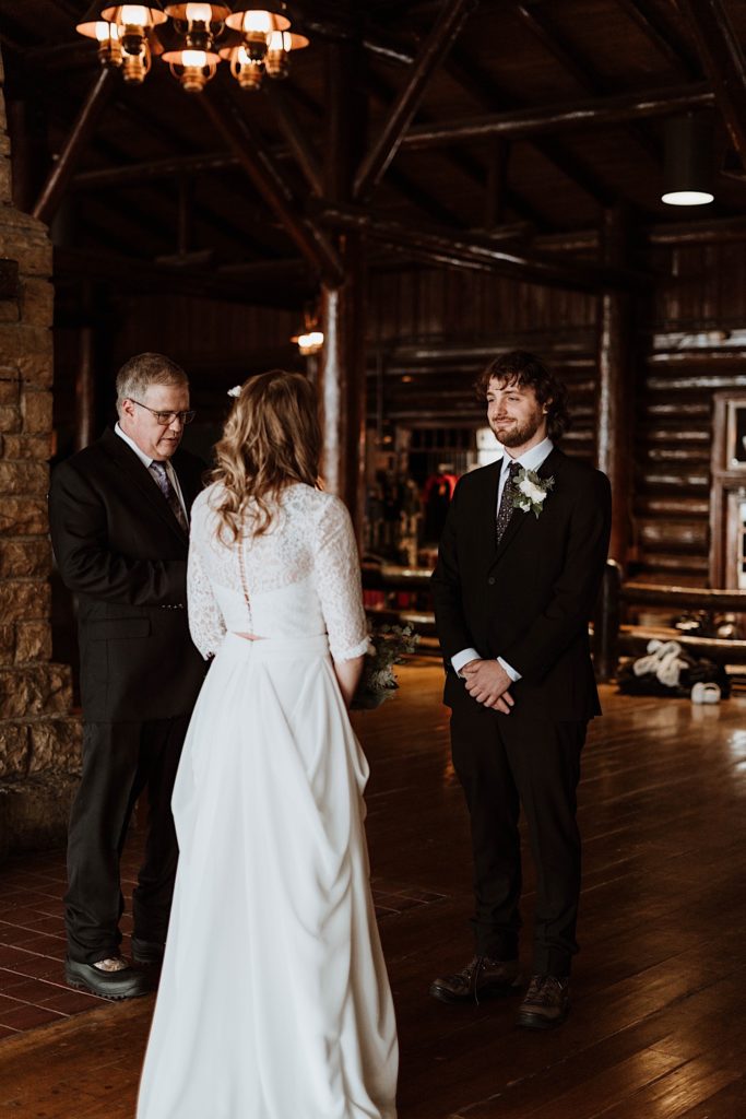 A bride and groom stand during their wedding ceremony at a cabin in Starved Rock National Park.