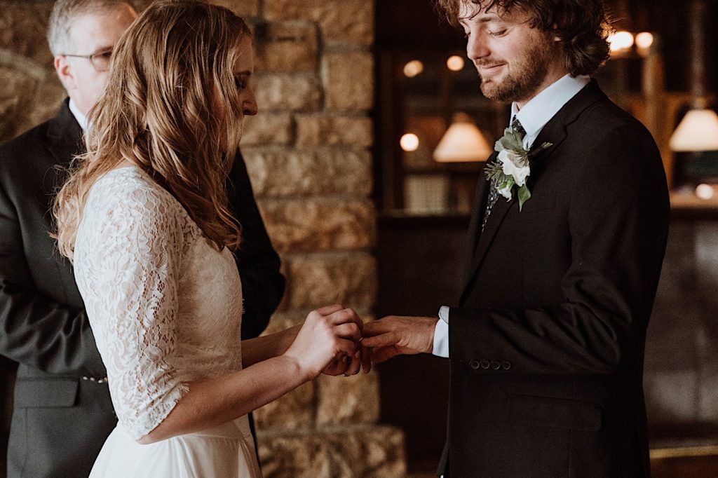 A bride and groom exchange rings during their wedding ceremony at Starved Rock National Park.