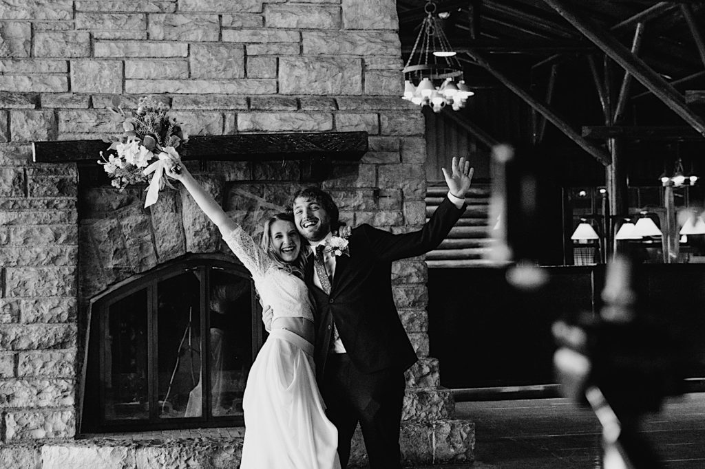 A couple celebrates their marriage immediately after their wedding at Starved Rock National Park.