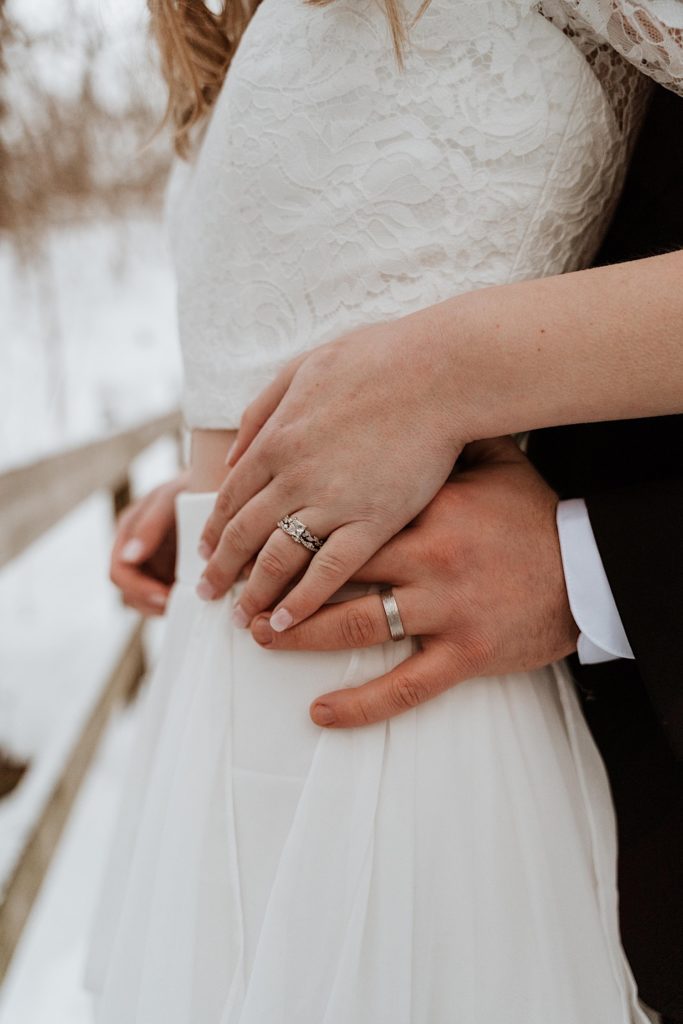 A close image of the bride and grooms hands with their wedding rings during their elopement at Starved Rock National Park