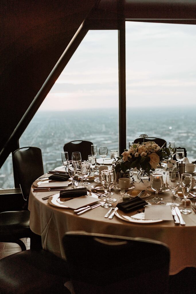 A table setting with the city of Chicago in the background.