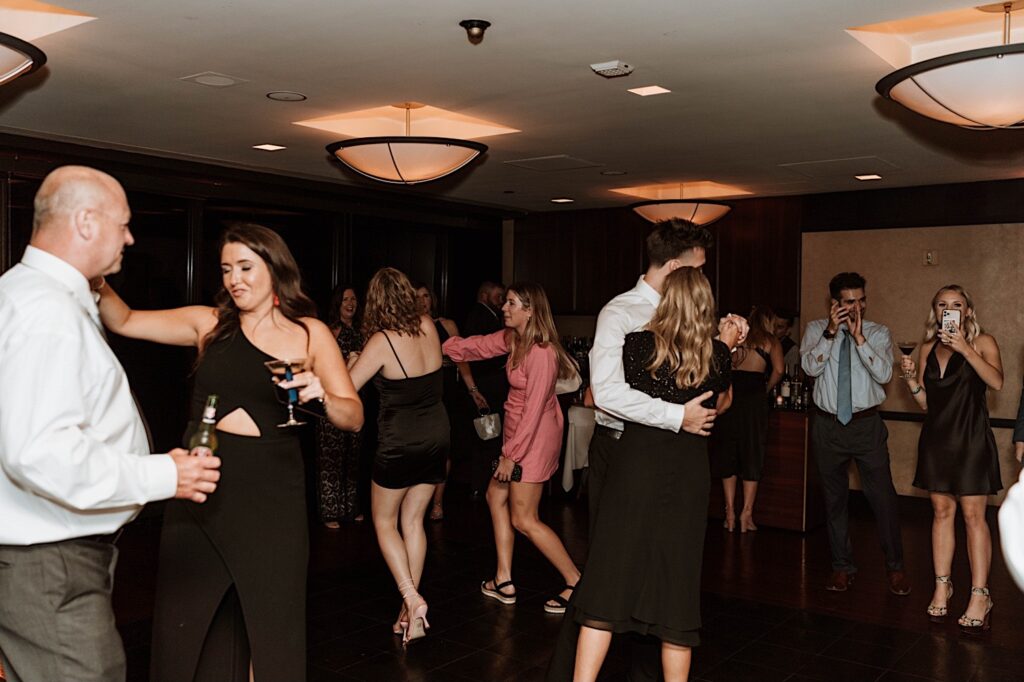 guests dance during a wedding reception thrown on the 95th floor.