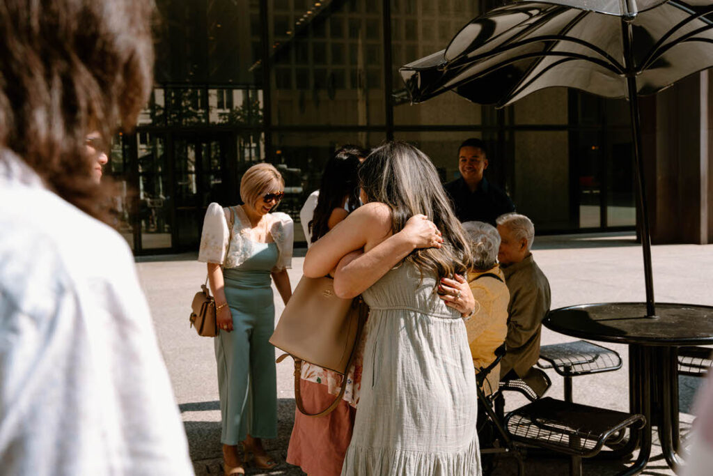 a group of people hugging outside