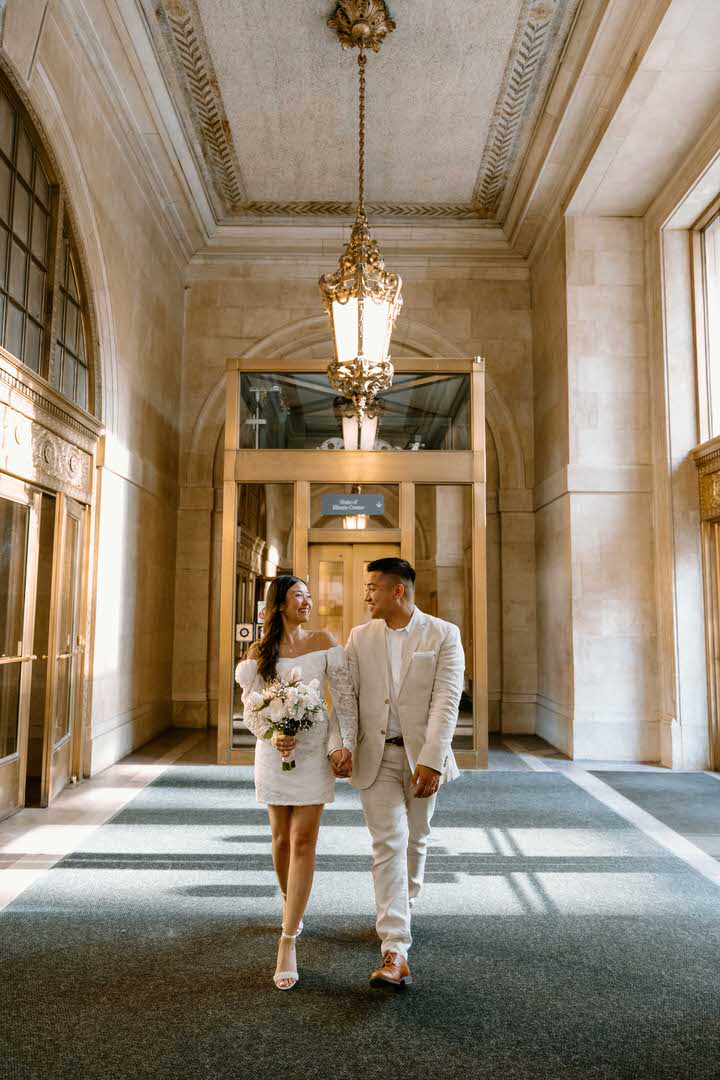 bride and groom leaving chicago city hall after they got married