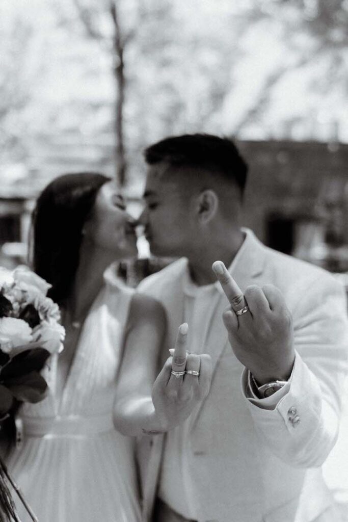 bride and groom showing of their rings after their chicago elopement