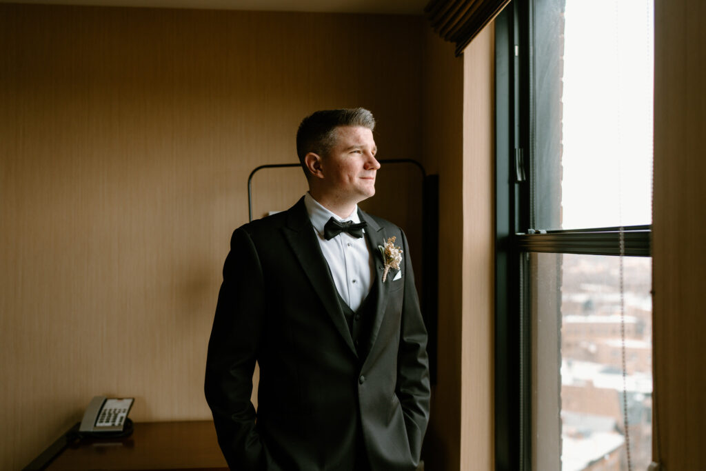 groom looking out the window