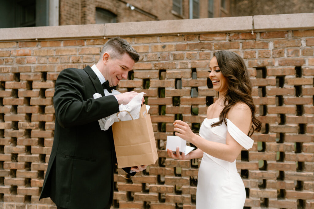 bride and groom exchanging gifts