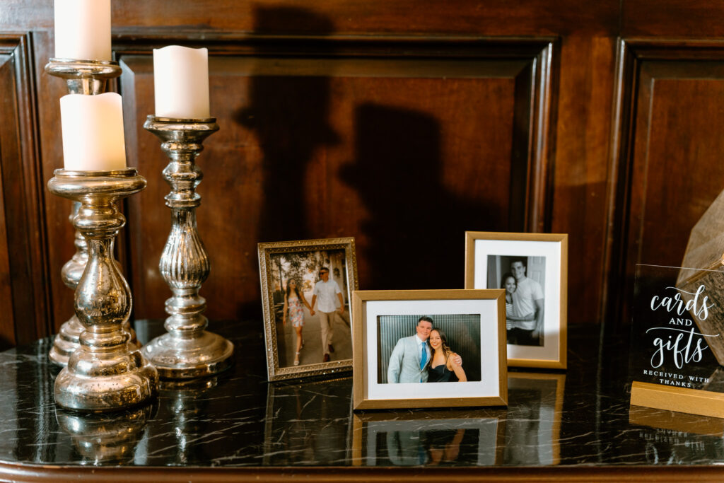 reception details of framed photographs of late loved ones