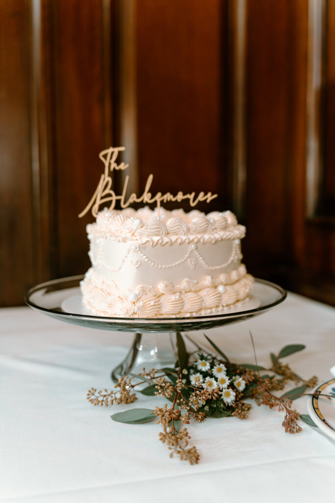 white vintage one tier cake with "The Blakemores"